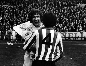Leeds v. Southampton. Leeds United player Norman Hunter receives a bunch of flowers