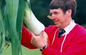 00113 Prints: The Leek Show at Beamish Museum and judge Dennis Ash inspect one of the entries in