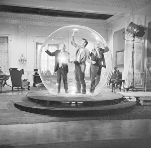 Left to right Eric Portman, Laurence Harvey and Lionel Jeffries seen here on the set of