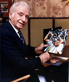 Legendary English footballer Sir Stanley Matthews holding a photograph of Paul Gascoigne