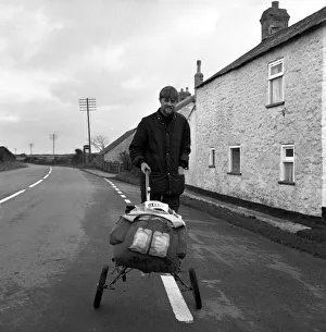 Trolley Prints: Legless Norman Croucher, 29, walking from John o Groats on artificial legs nears his