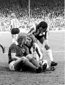 Men Only Prints: Leicester City footballer Alan Birchenall kisses and makes up with Tony Currie of