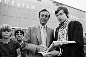 Leicester City manager Jimmy Bloomfield signs autographs for fans outside Filbert Street