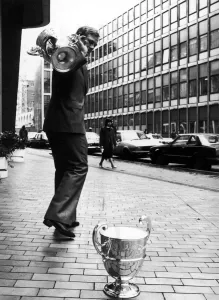 00412 Prints: Leicester Rugby Union captain Peter Wheeler walks off with the old John Player Cup which