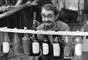 Len Austin and his boozaphone, a musical instrument made from old beer and wine bottles