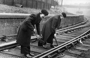 Lengthwomen at work oiling and scraping at Westbourne Park Railway Station, GWR