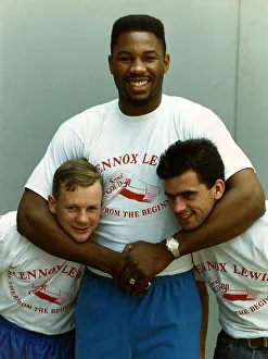 Lennox Lewis Boxing Heavyweight Boxer with his arms around the necks of Alan Hall