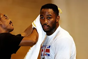 00129 Prints: Lennox Lewis Boxing Heavyweight Boxer takes a break during a training session for his