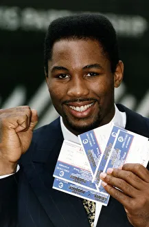 Lennox Lewis Heavyweight Boxer holding tickets to Razor Ruddock fight