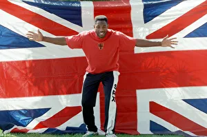 Flag Prints: Lennox Lewis poses with a hug England flag ahead of his WBC world title fight with Tony