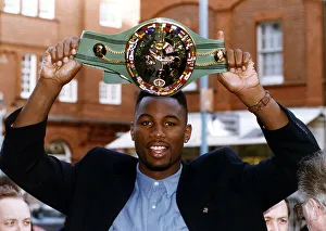 Lennox Lewis World Heavyweight Boxing Champion Holding Aloft The WBC Boxing Belt