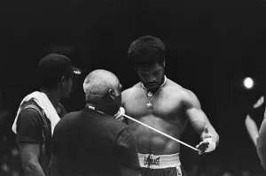 Leon Spinks (right) wrapping his hands in the gym ahead of his second fight with Muhammad
