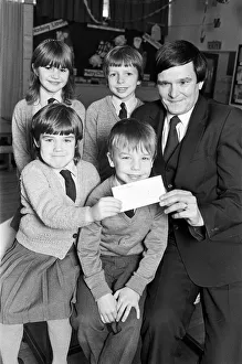 00523 Prints: Lepton C of E Church school pupils present cheque for 127 to RNIB appeals organiser