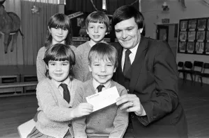 Lepton C of E Church school pupils present cheque for 127 to RNIB appeals organiser