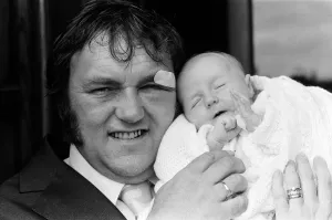 Les Dawson with his baby daughter Pamela Jane at her christening at Cleveleys, Lancashire