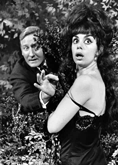 Leslie Phillips actor with actress Catherine Feller in one of the scenes from the film