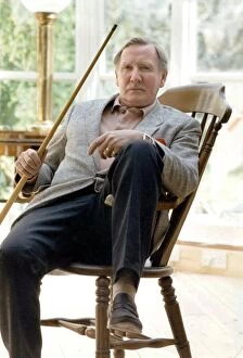 01476 Collection: Leslie Phillips relaxing at home during interview - May 1990