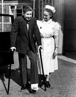 Images Dated 3rd July 2012: Lester Piggott with a nurse and broken foot or toe. 15th September 1951