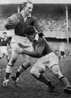 01149 Prints: Lewis Jones avoids a tackle from Noel Henderson of Ireland at Landsdowne Road during