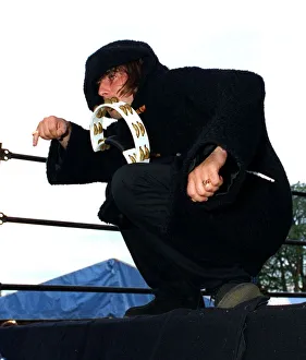 Liam Gallagher playing the tambourine during the Oasis concert at Balloch Country Park