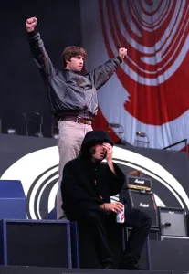 Liam and Noel Gallagher greet the crowd during the Oasis concert at Balloch Country Park