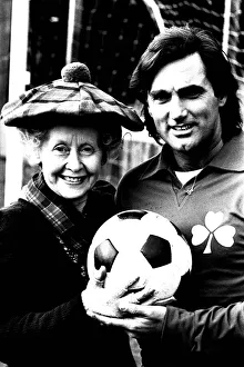 00458 Prints: Lib - Football legend George Best giving actress Gudrun Ure some footballing tips during