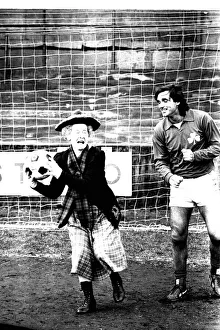 00458 Prints: Lib - Football legend George Best giving actress Gudrun Ure some footballing tips during