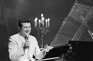 Pianist Prints: Liberace entertains the audience at The Royal Variety Show held in the presence of her
