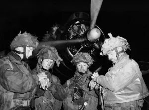 D Day Prints: Liberation of Europe. Picture shows: These four officers set their watches before
