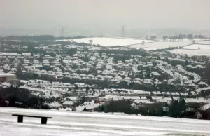 Winter Prints: The Lickey Hills looking down over Rubery, houses covered by snow as the cold snap hits