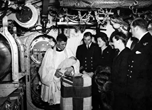 Lieut. Commdr HRB Newton and and wife at christening service of their son Max in Torpedo