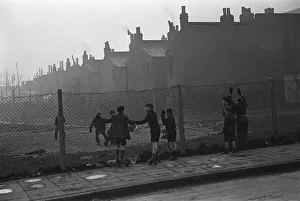 Life in the Mirror Our Gang. 19th January 1954 Boys playing football watched on by