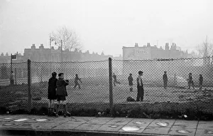 Boys Prints: Life in the Mirror Our Gang. 19th January 1954 Boys playing football watched on by