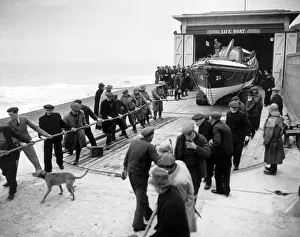 00572 Prints: Lifeboatmen of Sheringham, Norfolk stand by during operational flights over the North Sea
