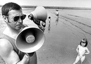 Lifeguards Prints: Lifeguard Thomas Todd of the Inshore Rescue boat at Roker with the tow way megaphones