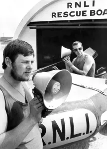 00119 Prints: Lifeguards James Elwood (left) and Thomas Todd with megaphones which can pick up cries