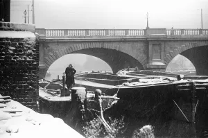Barges Prints: A lighterman secures his barges below Kingston Bridge on the River Thames