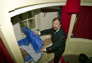 Lighthouse Prints: Lighthouse keeper Colin Jones seen here rolling up his sleeping bag during this last