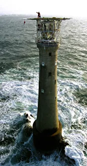 Solitude Prints: Lighthouse keeper Colin Jones seen here waiting on the helipad for the helicoptrt during