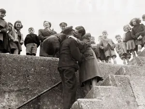 Lighthouse worker John Mcleod is greated by his wife after 77 days confined in