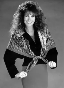 1980s Fashion Prints: Linda Lusardi Model Ex Page 3 girl wearing a scarf over a jumper and a skirt