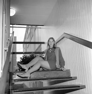 Linda Sewell aged 18 wearing a mini skirt sitting on the steps December 1969