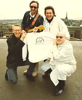 00038 Prints: Lindisfarne members with a Newcastle United share issue t-shirt. 07 / 11 / 90