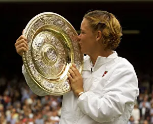 Womens Game Prints: Lindsay Davenport of the U. S. July 1999 holding and kissing the trophy after