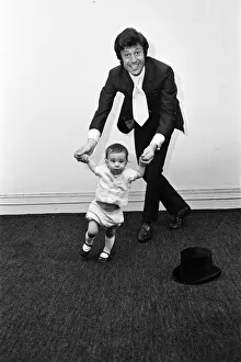 Lionel Blair giving dancing tuition to his 10-month-old son Daniel. 23rd June 1969