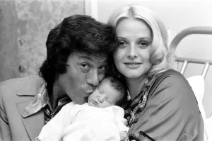 01175 Prints: Lionel Blair with his wife Susan and their new baby daughter Lucy at the Avenue Clinic
