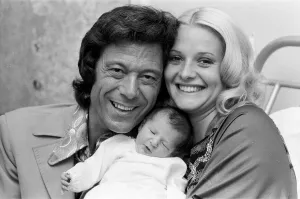 01175 Prints: Lionel Blair with his wife Susan and their new baby daughter Lucy at the Avenue Clinic