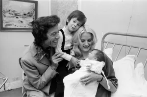 01175 Prints: Lionel Blair with his wife Susan and their new baby daughter Lucy at the Avenue Clinic