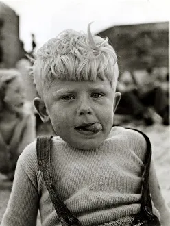 Dungarees Prints: Little boy with sand all over him, tousled hair and ice cream tongue sticking out his