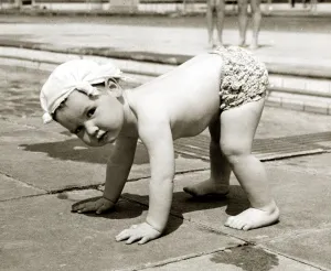 Handkerchief Prints: Little boy wearing a handkerchief on his head pictured balancing on all fours